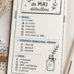 Bullet Journal ouvert avec des pages colorées pour le mois de mai